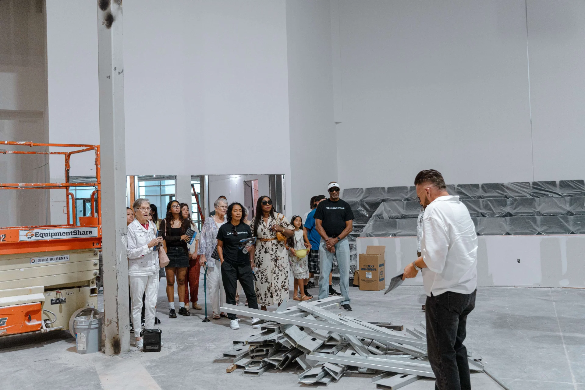 Partners gathered in the new Worship Center during a tour