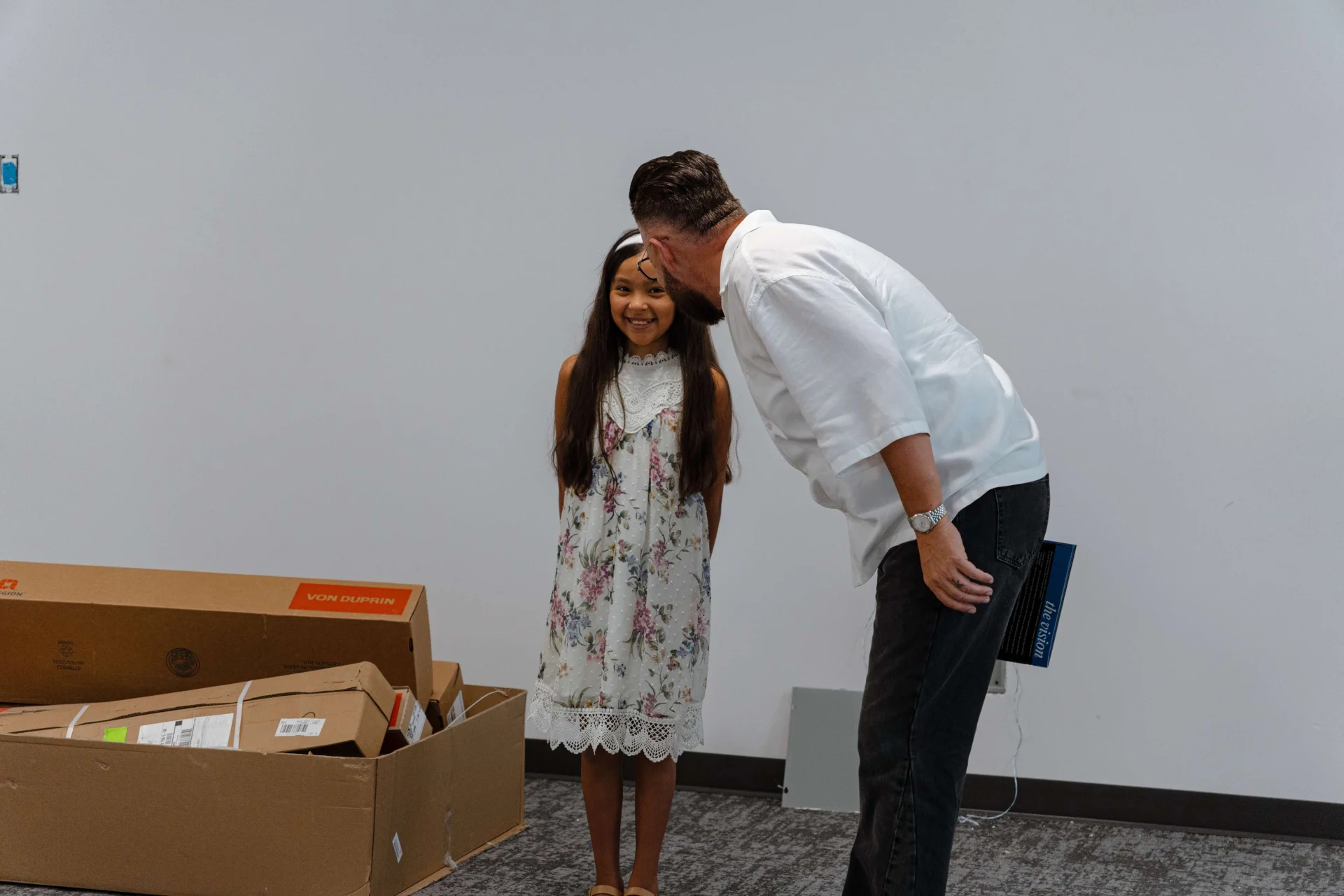 Pastor Ben with a child in the future children's area during a tour