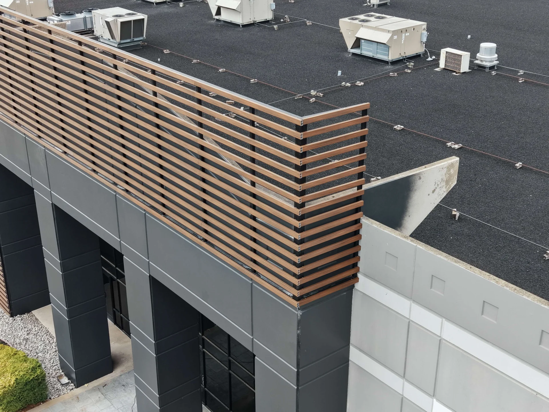 Exterior wooden slats going in at 4600 Regent Blvd